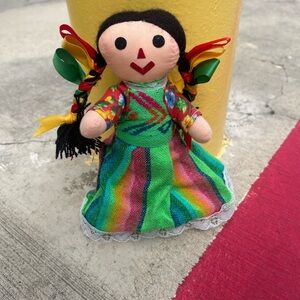 Hand made in Mexico, this rag doll is representative of the culture.